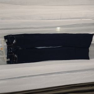 Women's American eagle super stretched dark blue jeans size 6 long.